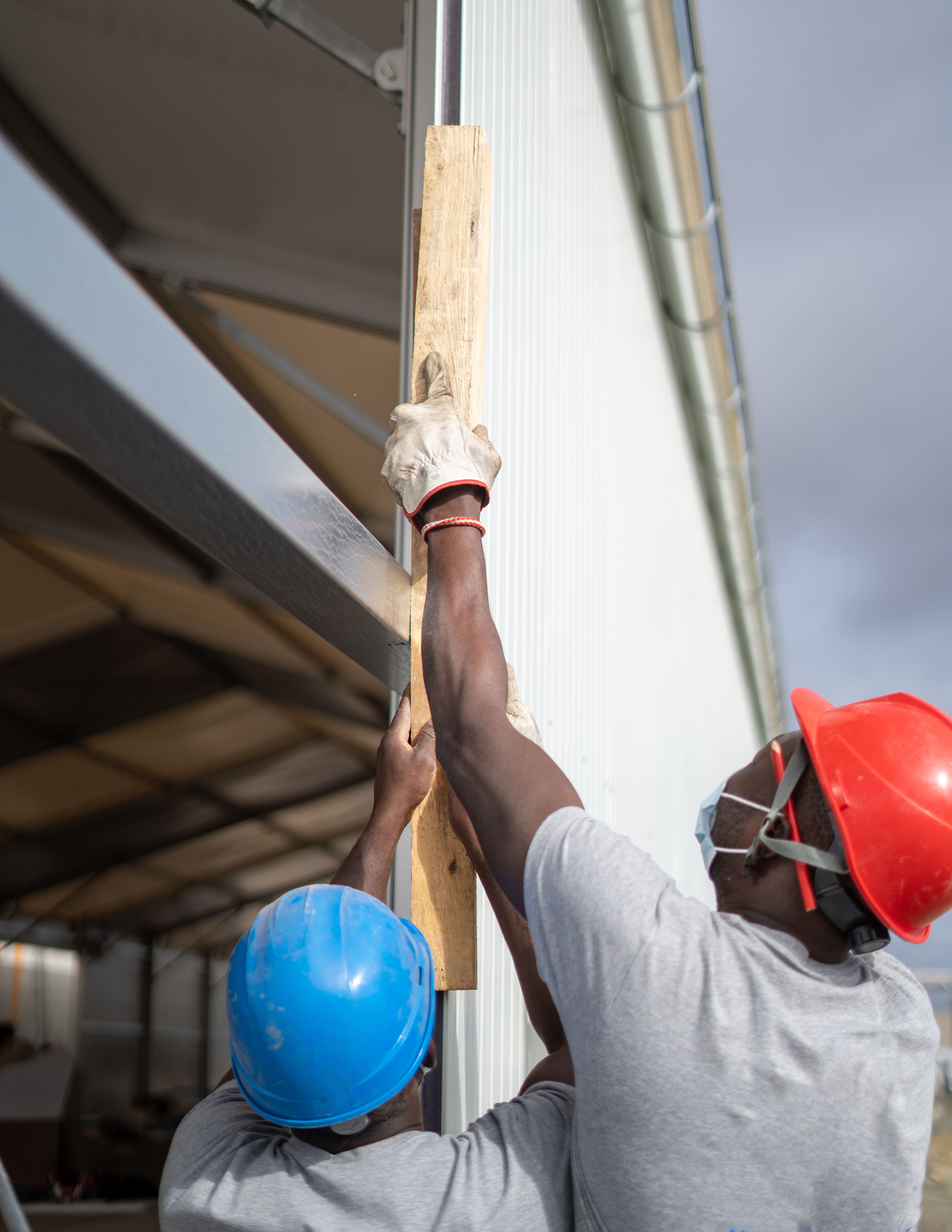 Starrlight engineers reviewing construction blueprints on site